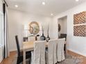 Elegant dining room featuring stylish decor, a modern light fixture, and ample natural light at 426 Bent Burr Crk, York, SC 29745