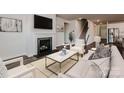 Cozy living room with fireplace, plush seating, and modern decor for a relaxing atmosphere at 431 Bent Burr Crk, York, SC 29745