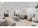 Bright living room featuring vaulted ceilings, neutral paint, contemporary decor and open concept design at 7416 Cross Tie Ct, Mint Hill, NC 28227