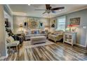 Inviting living area with a cozy seating arrangement, wood floors, and ample lighting at 800 Sunset Rd, Cherryville, NC 28021