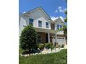 Beautiful home with manicured front yard and a mix of brick and siding exterior at 112 Paradise Hills Cir, Mooresville, NC 28115