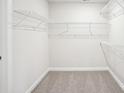 A walk-in closet with gray carpet and wire shelving that offers plenty of storage at 119 Obadiah Ct, Mooresville, NC 28115