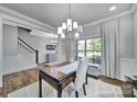 Elegant office featuring decorative trim work, natural light, and hardwood floors at 2015 Knocktree Dr, Indian Trail, NC 28079