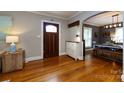Inviting foyer with hardwood floors, an archway to the dining area, and a charming entryway table at 2124 Chatham Ave, Charlotte, NC 28205