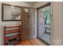 Inviting foyer with hardwood floors, showcasing a convenient coat rack and ample natural light at 2808 Findley Rd, Statesville, NC 28625