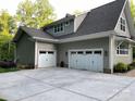 Spacious three-car garage with ample parking space and a well-maintained exterior at 3201 Johnny Cake Ln, Charlotte, NC 28226