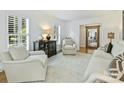 Inviting living room with hardwood floors, neutral color palette, and plantation shutters at 3620 Champaign St, Charlotte, NC 28210