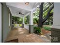 Spacious front porch with swing, providing a relaxing outdoor living space at 417 N Dotger Ave, Charlotte, NC 28204