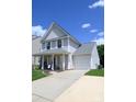 Well-maintained two-story home with attached garage, manicured lawn, and inviting curb appeal at 417 Trillium Sw Ct, Conover, NC 28613