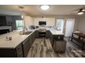 Modern kitchen featuring stainless steel appliances, white countertops, and stylish gray lower cabinets at 417 Trillium Sw Ct, Conover, NC 28613