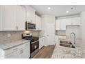 Well-equipped kitchen features stainless steel appliances and stylish countertops at 432 Bent Burr Crk, York, SC 29745