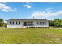 Charming white ranch home with a black roof and a welcoming front porch at 4855 Saluda Rd, Rock Hill, SC 29730
