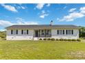 Inviting home featuring a white brick facade, black shutters, and a lush green lawn at 4855 Saluda Rd, Rock Hill, SC 29730