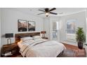 Bedroom features hardwood floors, large windows and soft accents at 513 N Graham St # 1B, Charlotte, NC 28202