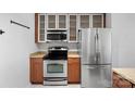 Well-equipped kitchen with stainless steel appliances, granite countertops, and ample cabinet space at 513 N Graham St # 1B, Charlotte, NC 28202