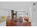 Bright and open living room featuring hardwood floors and a large window, creating an inviting space at 513 N Graham St # 1B, Charlotte, NC 28202