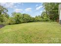 Expansive, well-maintained backyard with a play structure, providing ample space for recreation and enjoyment at 702 S Government St, Lincolnton, NC 28092