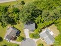 An aerial view showcases a home surrounded by mature trees, offering privacy in a serene setting at 812 Thornapple Ct, Lake Wylie, SC 29710