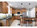 Well-equipped kitchen boasting stainless steel appliances, ample cabinet space, and island with seating at 905 Patricians Ln, Monroe, NC 28110