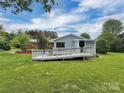 A home exterior showcases a wooden deck and ramp, perfect for enjoying outdoor living at 104 Tobe Bridge Rd, Kings Mountain, NC 28086