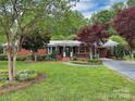 Lovely brick home featuring a well-manicured lawn, mature trees, and a welcoming entrance at 104 Tobe Bridge Rd, Kings Mountain, NC 28086