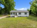 Charming one-story home with a well-maintained lawn and inviting entrance on a sunny day at 109 Jackson St, Salisbury, NC 28144