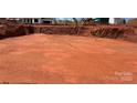 A spacious building site with red dirt and heavy machinery at 1099 Sugar Creek Rd, Indian Land, SC 29707