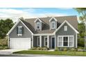 Charming two-story home with blue door, attached garage, and a well-manicured lawn at 1099 Sugar Creek Rd, Indian Land, SC 29707