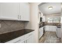 Galley kitchen featuring white cabinets, granite countertops, stainless steel appliances at 1125 Jasmine Dr, Fort Mill, SC 29707