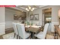 Formal dining room featuring a stylish table setting, elegant decor, and ample natural light at 146 Ventor Way, Mooresville, NC 28115