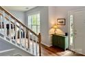 Sunlit entryway with hardwood floors, white trim, and decorative accents at 2330 Winthorp Ridge Rd, Charlotte, NC 28270