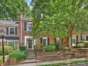 Charming brick townhome with lush landscaping and a welcoming entrance at 4464 Mullens Ford Rd, Charlotte, NC 28226