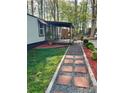 Single story home with a covered porch, paved walkway, gravel driveway, and landscaped yard at 475 Dot Faris Rd, Catawba, SC 29704