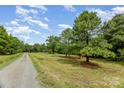 Expansive property with mature trees, offering a peaceful and scenic environment at 5523 Flint Ridge Church Rd, Marshville, NC 28103