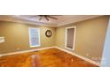 Cozy bedroom featuring hardwood floors and a ceiling fan at 615 Grier St, Lincolnton, NC 28092