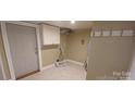 Functional laundry room with cabinet and new flooring at 615 Grier St, Lincolnton, NC 28092