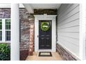 Close-up of the front door with a 'Welcome' sign and a decorative wreath at 865 Wingthorn Rose Dr, Gastonia, NC 28056