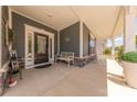Inviting covered porch with a cozy bench seating area for enjoying the outdoors at 1022 Curling Creek Dr, Indian Trail, NC 28079