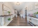 Elegant hallway with beautiful hardwood floors and decorative accents throughout at 1022 Curling Creek Dr, Indian Trail, NC 28079