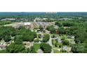 Aerial view showcasing the property's location with lush greenery and proximity to Downtown Belmont at 1105 S Point Rd, Belmont, NC 28012