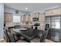 Eat-in kitchen featuring granite countertops, stainless steel appliances and light gray cabinetry at 122 Dyssa Loop, Statesville, NC 28625