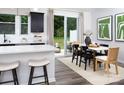 Dining area with modern table, chairs, and sliding glass doors to outdoor patio at 12305 Gambrell Dr, Charlotte, NC 28278