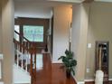 Inviting foyer with hardwood floors, staircase, and natural light, showcasing the home's open layout at 13123 Ashley Meadow Dr, Charlotte, NC 28213