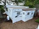 A Flagstaff Classic Super Lite RV with an awning, ready for memorable outdoor experiences and adventures at 164 Dogwood Cir, New London, NC 28127