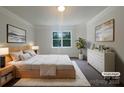 Calming bedroom with neutral decor, a large window, and soft textures at 177 Jacobs Woods Cir, Troutman, NC 28166