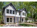 Contemporary exterior showcasing a well-manicured lawn and stylish architectural details at 2006 St John St, Charlotte, NC 28216