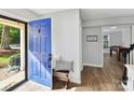 Inviting entryway with a blue door, bench, and 'Home Sweet Home' decor, creating a warm, welcoming atmosphere at 2315 Lawton Bluff Rd, Charlotte, NC 28226