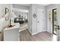 Open foyer with hardwood floors, neutral walls, and a view into the living room, showcasing a welcoming entrance at 2315 Lawton Bluff Rd, Charlotte, NC 28226