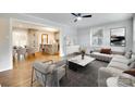 Spacious living room with hardwood floors, a ceiling fan, and an open concept design at 3120 Parkway Ave, Charlotte, NC 28208