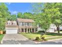 Traditional two-story home with a well-manicured lawn and a classic suburban aesthetic at 3632 Cole Mill Rd, Charlotte, NC 28270